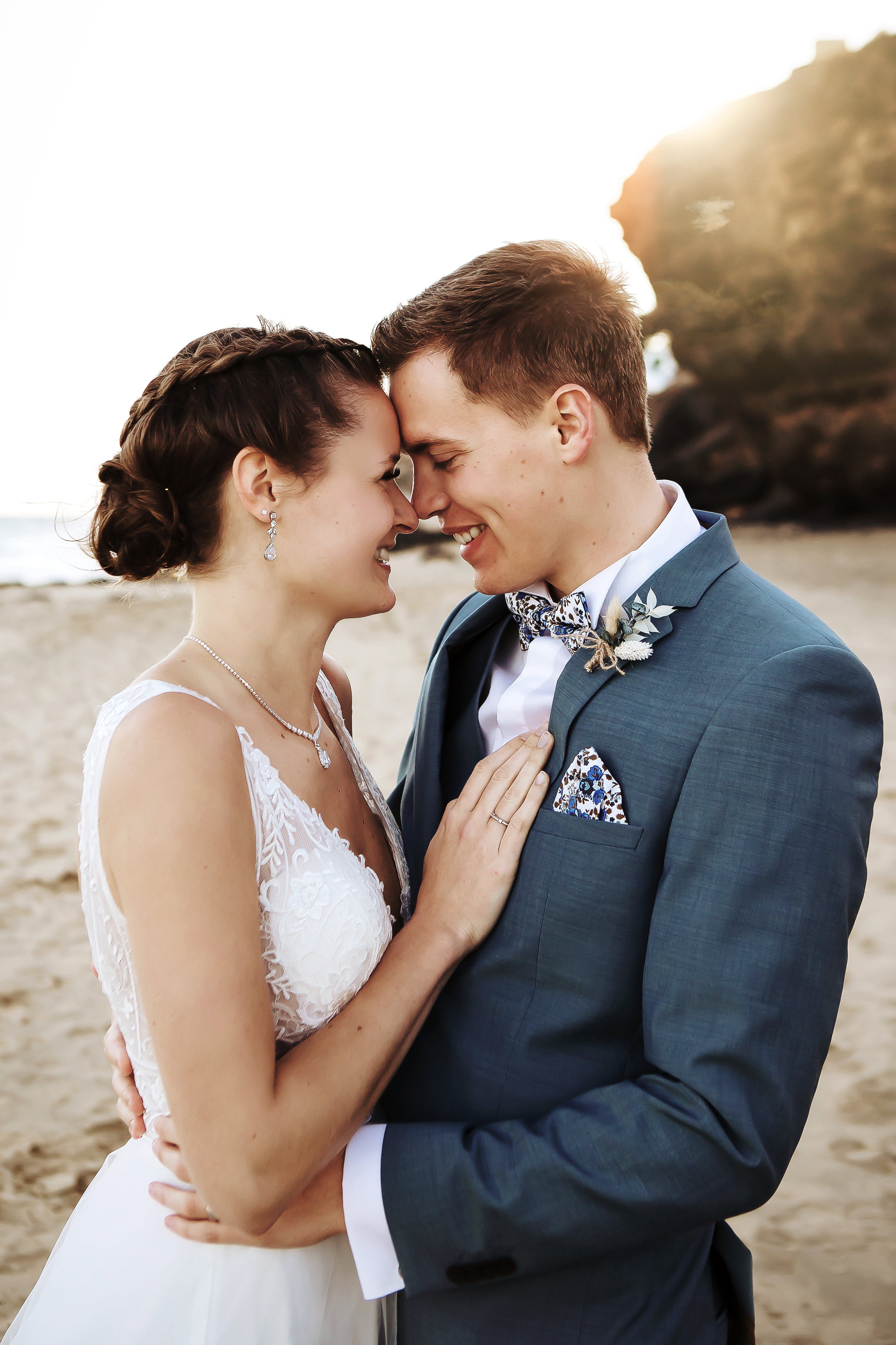 Lovely couple stands in front to each other at the beach in a wedding day in Fuerteventura