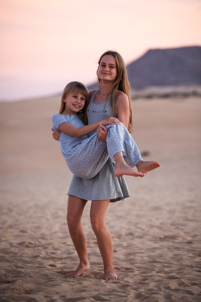 Golden hour silhouettes - Dutch family portraits against Corralejo's windswept dunes by premier photographer