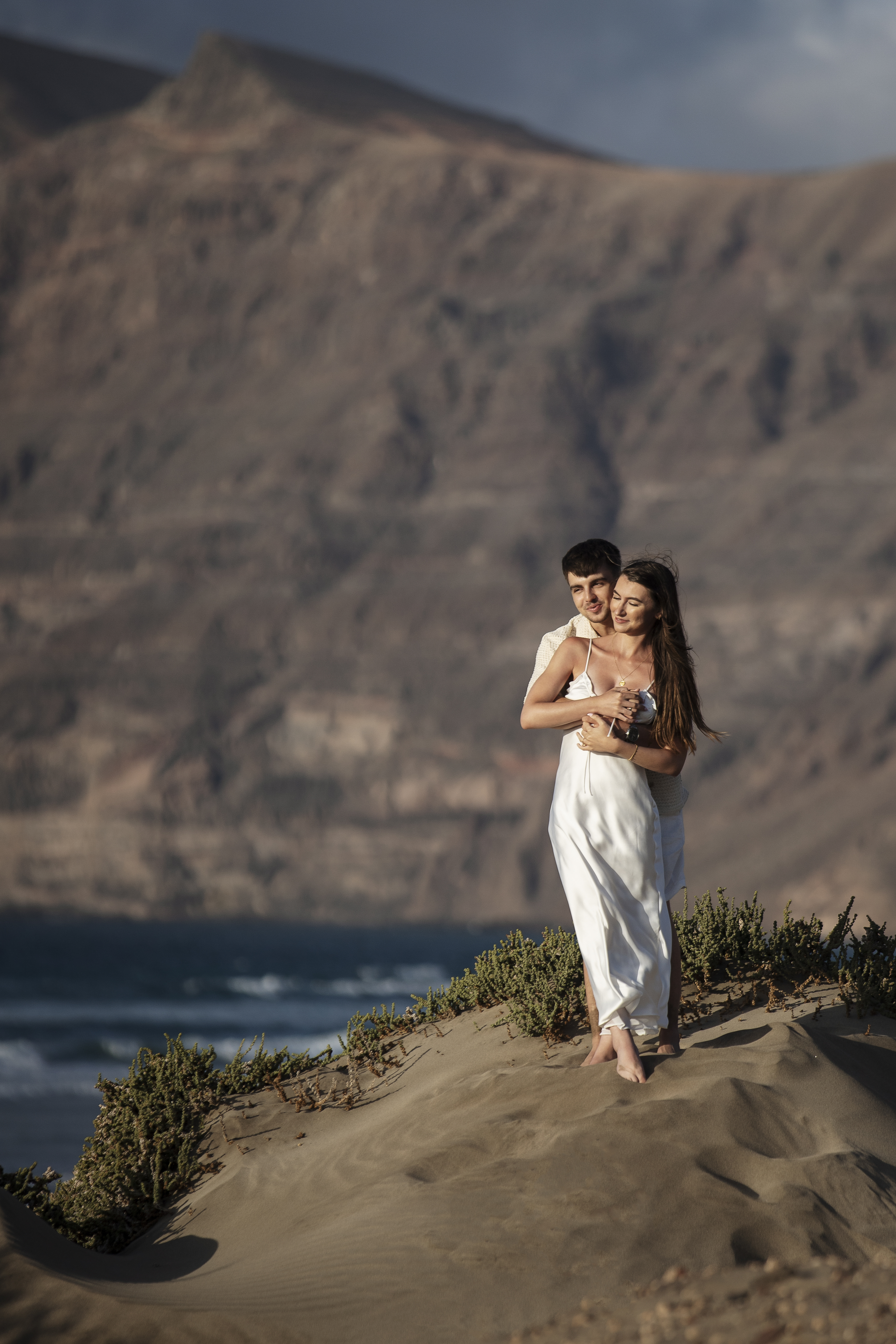 Couple proposal at sunset on Famara beach, Lanzarote – proposal photographer in Lanzarote capturing the love and excitement