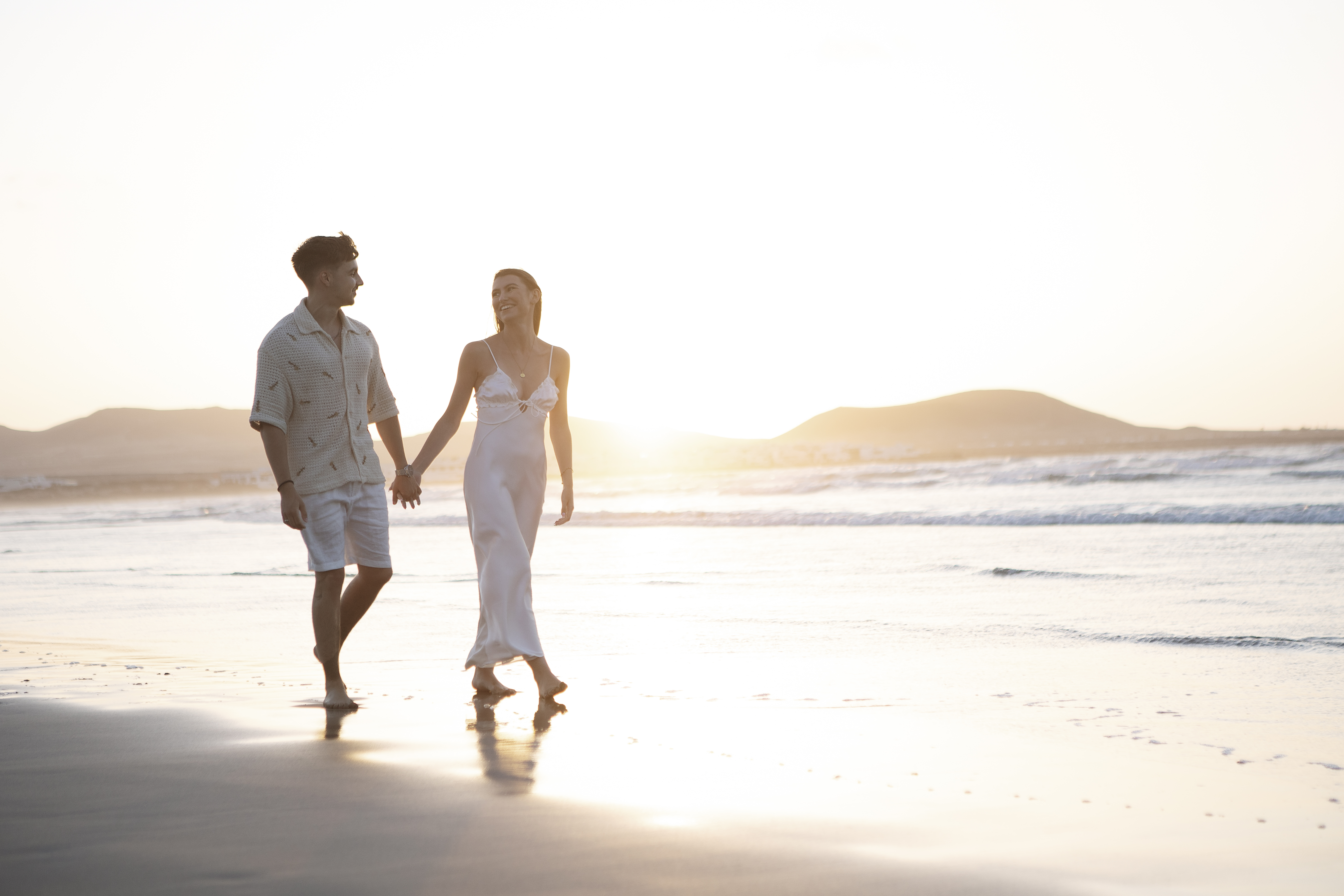 Romantic proposal on Famara beach at sunset in Lanzarote – professional couple photographer in Lanzarote capturing love