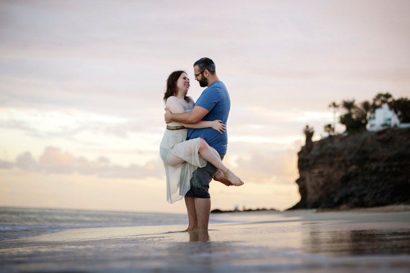Eloping in Fuerteventura – couple at sunset with ocean waves
